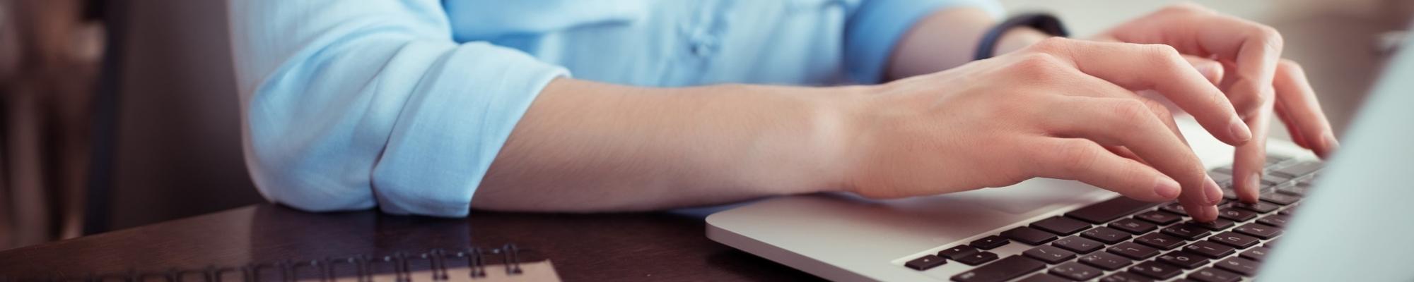 Lady typing on laptop